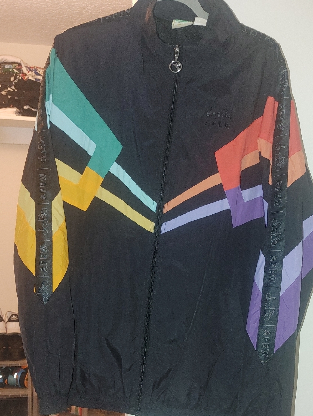 Diadora Black Jacket with Green Logo and Gold Accents